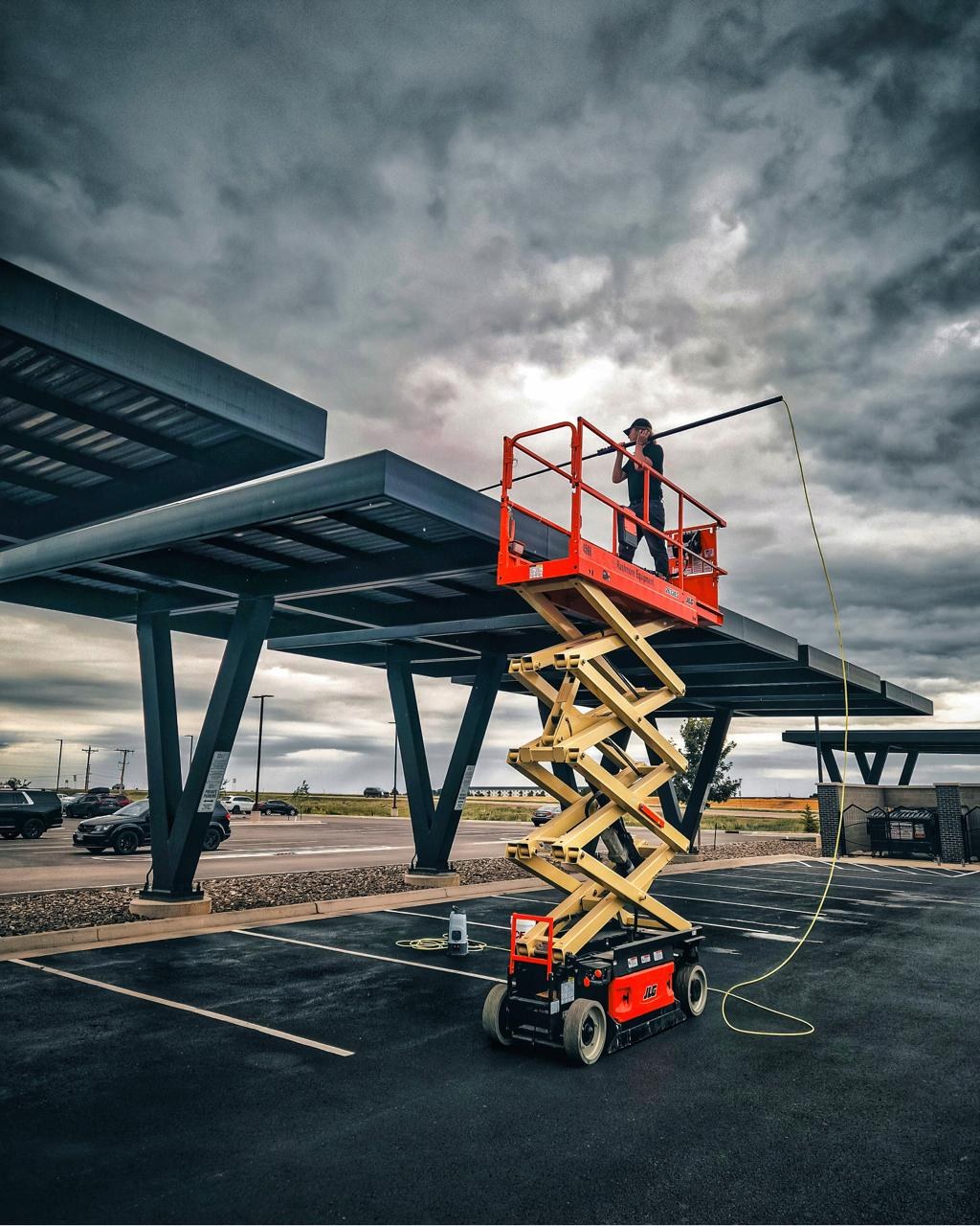 Commercial solar canopy cleaning with lift access